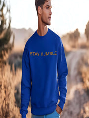Man wearing blue Embroidered Humble Sweatshirt outdoors