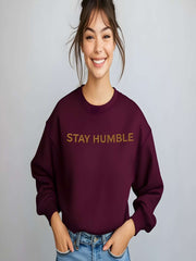 Smiling woman modeling maroon Embroidered Humble Sweatshirt indoors