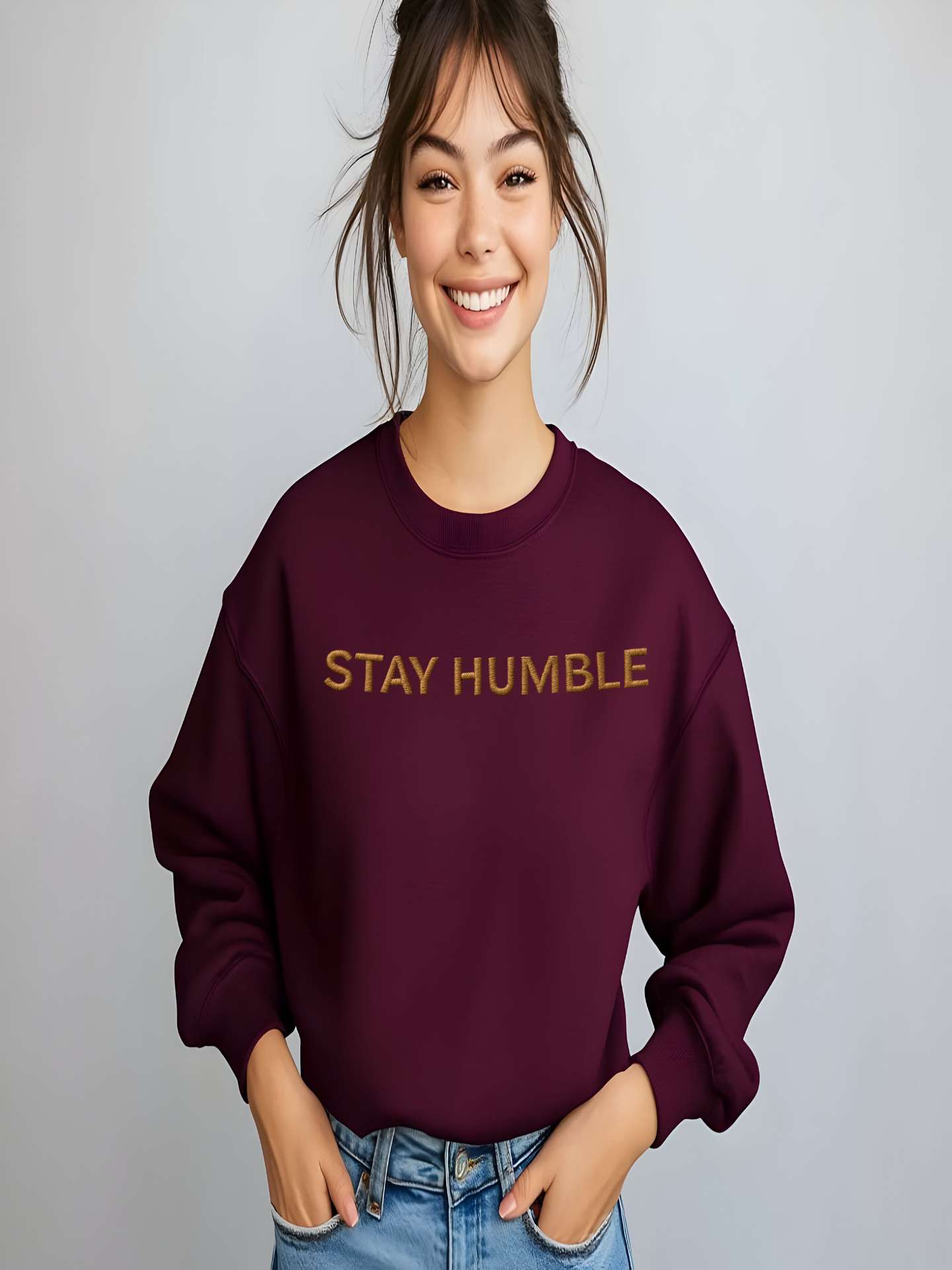 Smiling woman modeling maroon Embroidered Humble Sweatshirt indoors