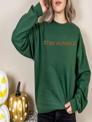 Woman posing in forest green Embroidered Humble Sweatshirt
