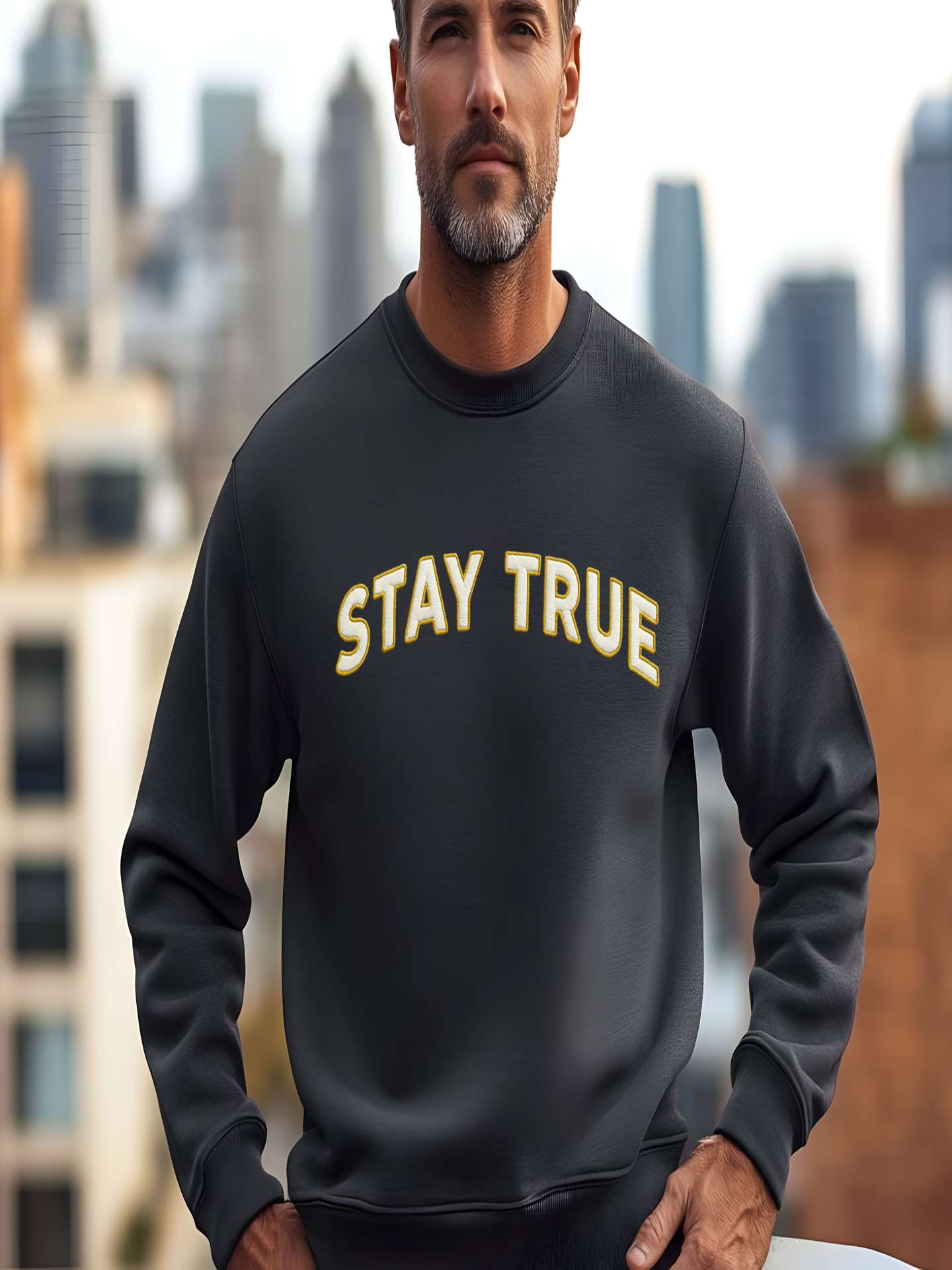 Man wearing black Embroidered Stay True Sweatshirt in the city.