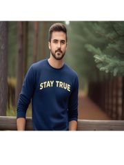 Man wearing Embroidered Stay True Sweatshirt in navy, casual outdoor look.