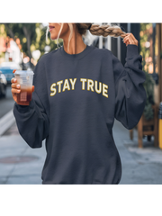 Casual look with navy Embroidered Stay True Sweatshirt in urban setting.