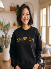 Woman at home in black Embroidered Shine On Sweatshirt