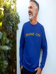 Man smiling in royal blue Embroidered Shine On Sweatshirt