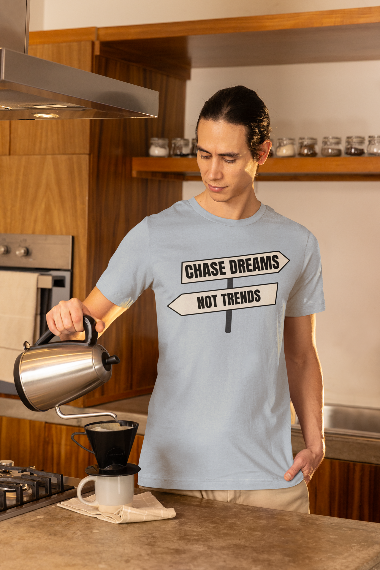 Chase Dreams T-Shirt worn by man in kitchen holding coffee mug