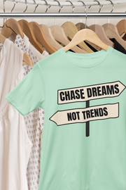 Chase Dreams T-Shirt hanging on rack with mint green and pastel tones