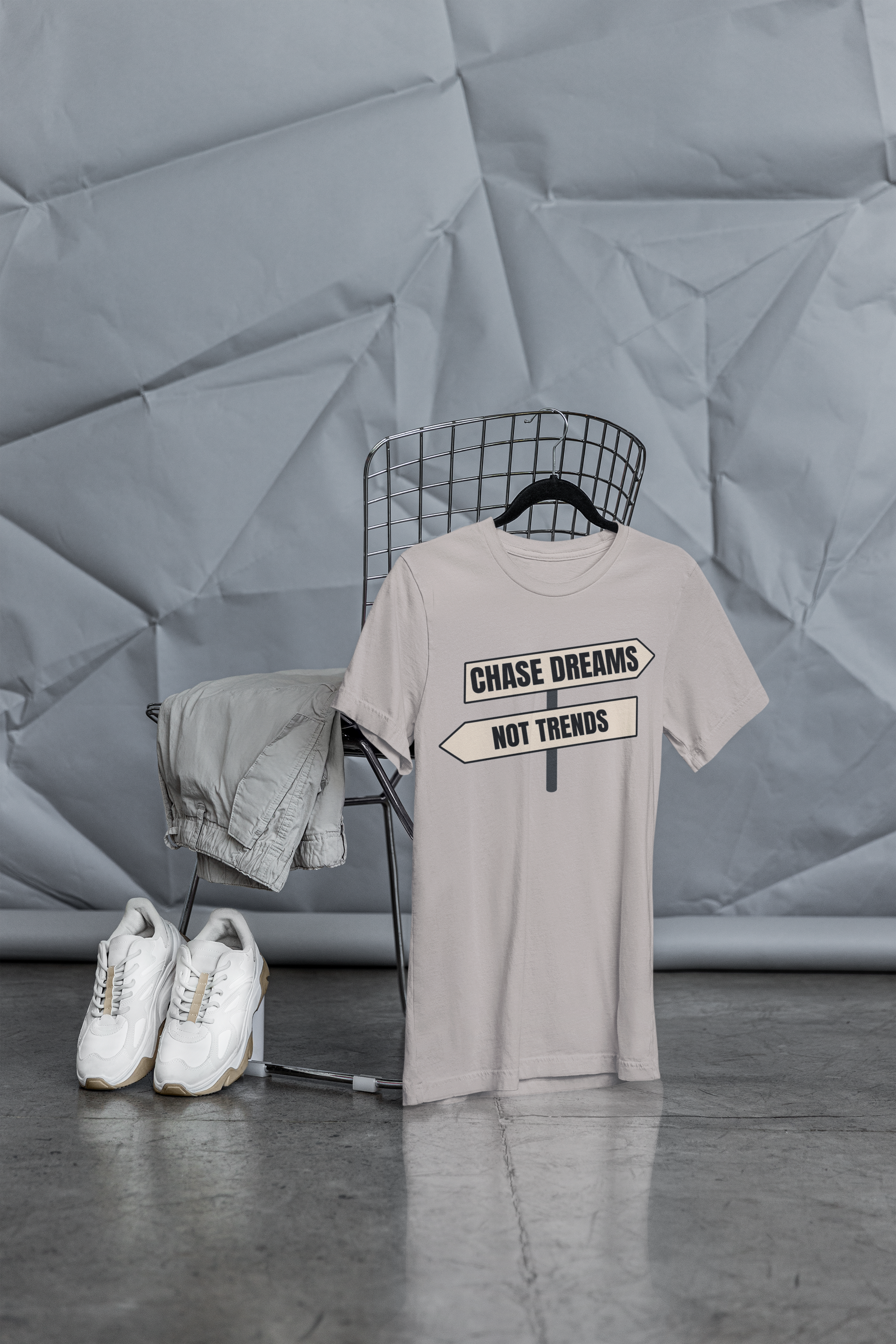 Chase Dreams T-Shirt on minimalist display with white sneakers
