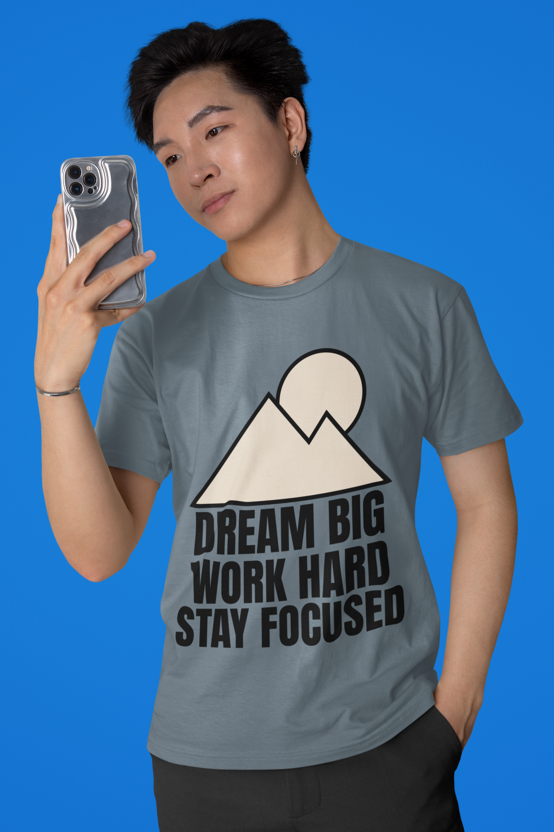 Mountain Minimalist T-Shirt displayed on a model, featuring a geometric mountain and sun graphic with motivational text.
