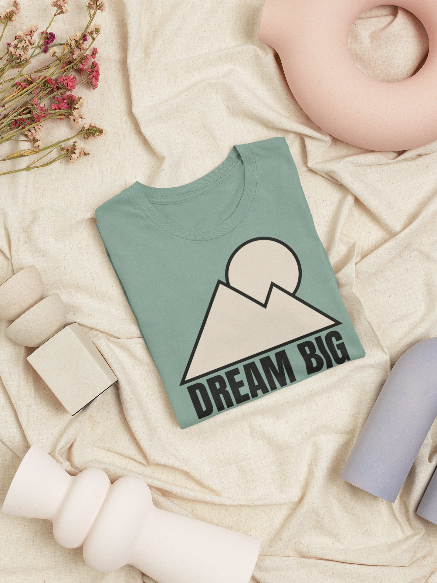 Mountain Minimalist T-Shirt displayed on a neutral background with a geometric mountain and sun design.