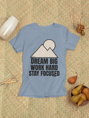 Mountain Minimalist T-Shirt with inspirational design on blue fabric, promoting positive mindset and connection with nature.
