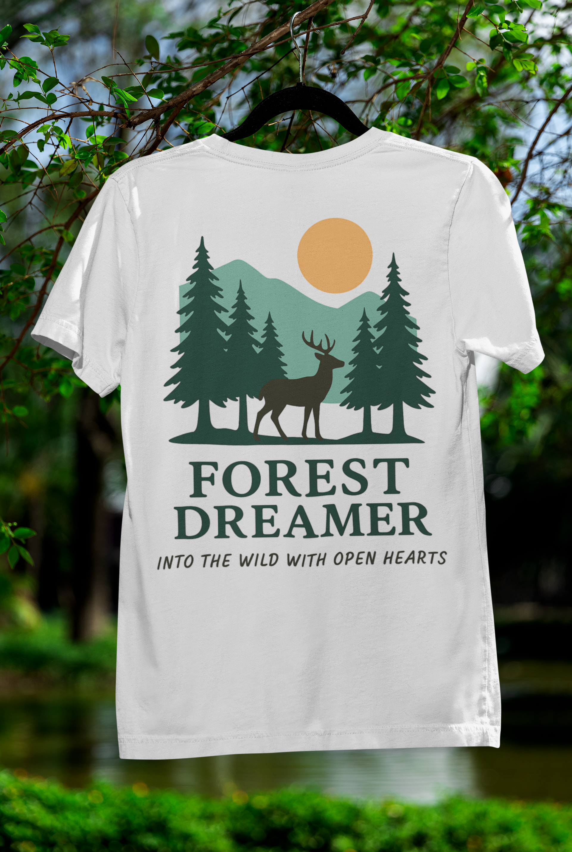 Close-up of Forest Dreamer T-Shirt on flat lay with forest design