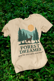 Forest Dreamer T-Shirt laid on grass, nature-inspired aesthetic