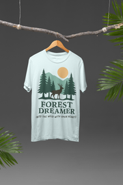 Forest Dreamer T-Shirt hanging in the sunlight with greenery