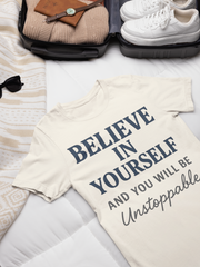 Believe in Yourself T-Shirt – flat lay unisex motivational tee folded with shoes