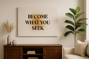  Motivational Wall Art Become What You Seek – Positive affirmation wall decor above a wooden cabinet with plant.