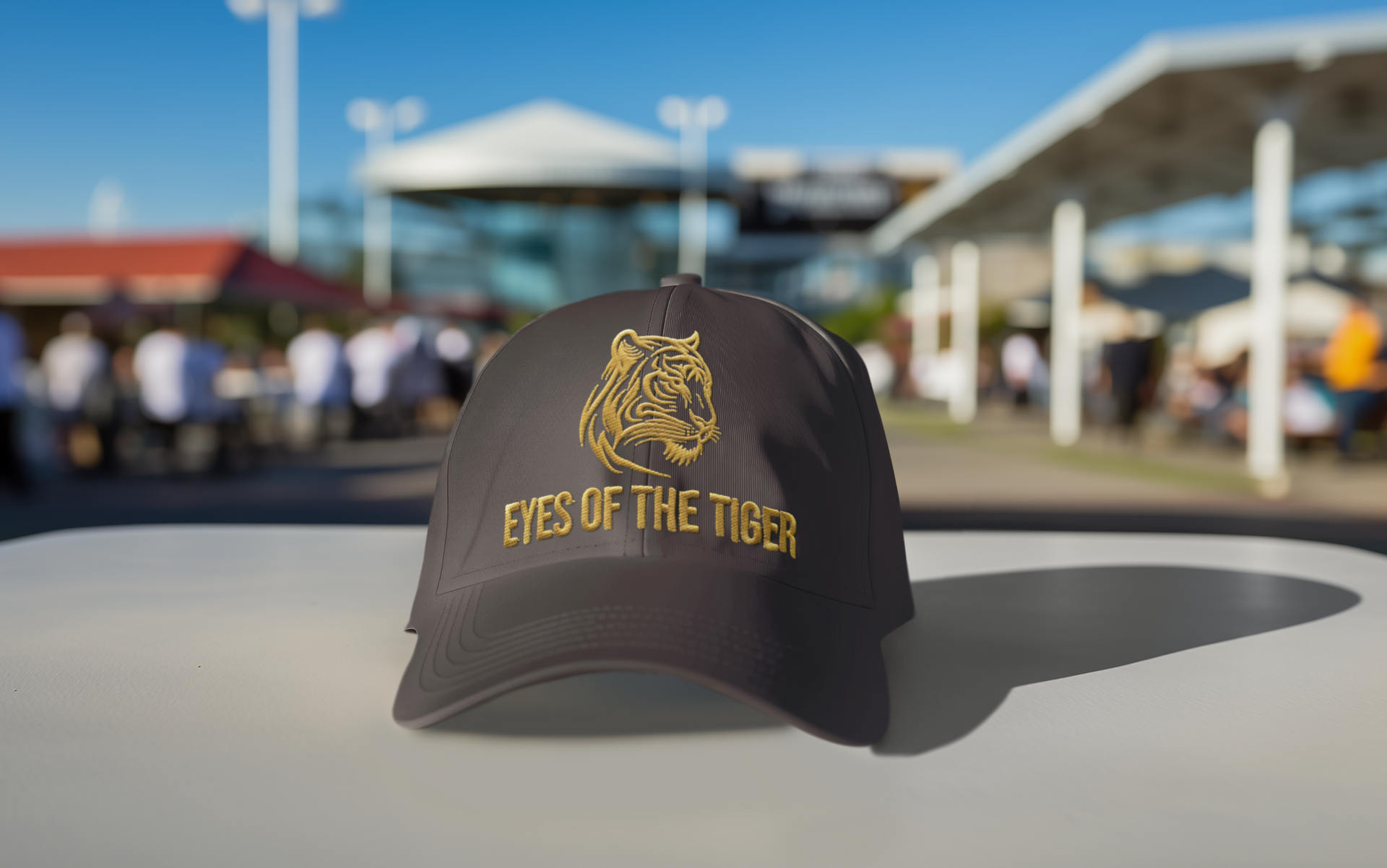  Embroidered Dad Hat Eyes of the Tiger – Black hat outdoors on a car with city background.
