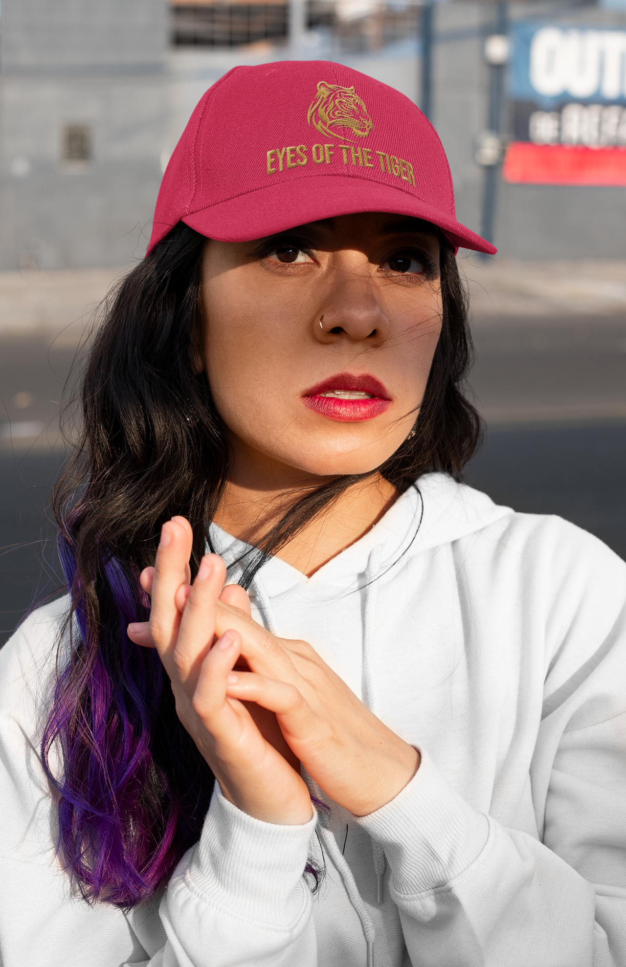 Embroidered Dad Hat Eyes of the Tiger – Red hat styled by woman with long sleeve shirt.