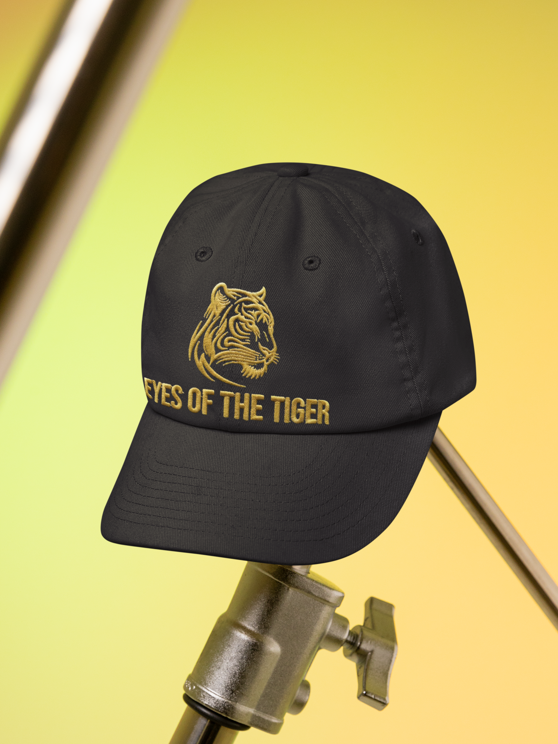  Embroidered Dad Hat Eyes of the Tiger – Black cap displayed on microphone stand in studio.