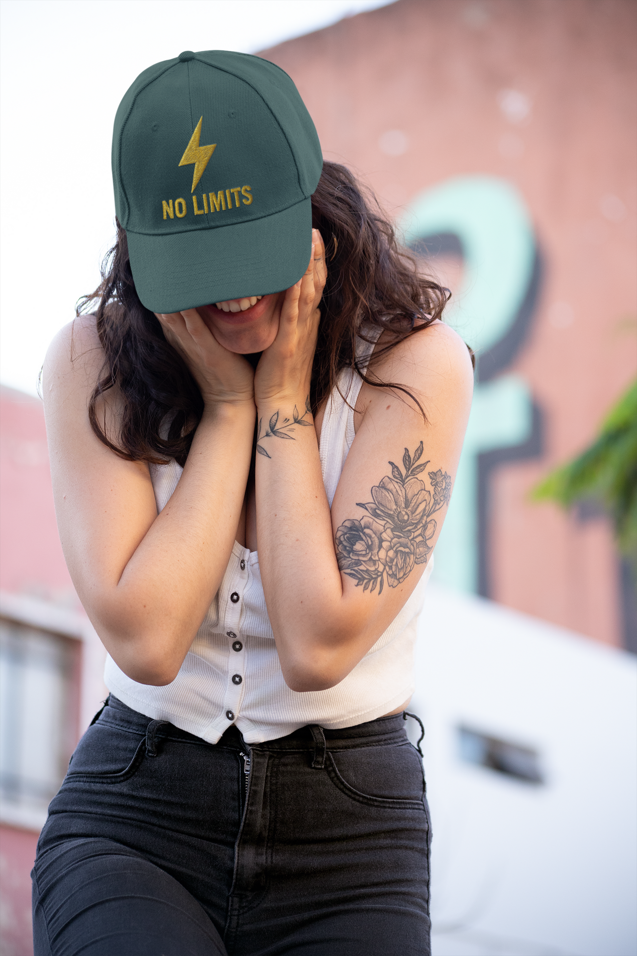 No Limits Embroidered Dad Hat – Green motivational cap with lightning design worn by woman outdoors.
