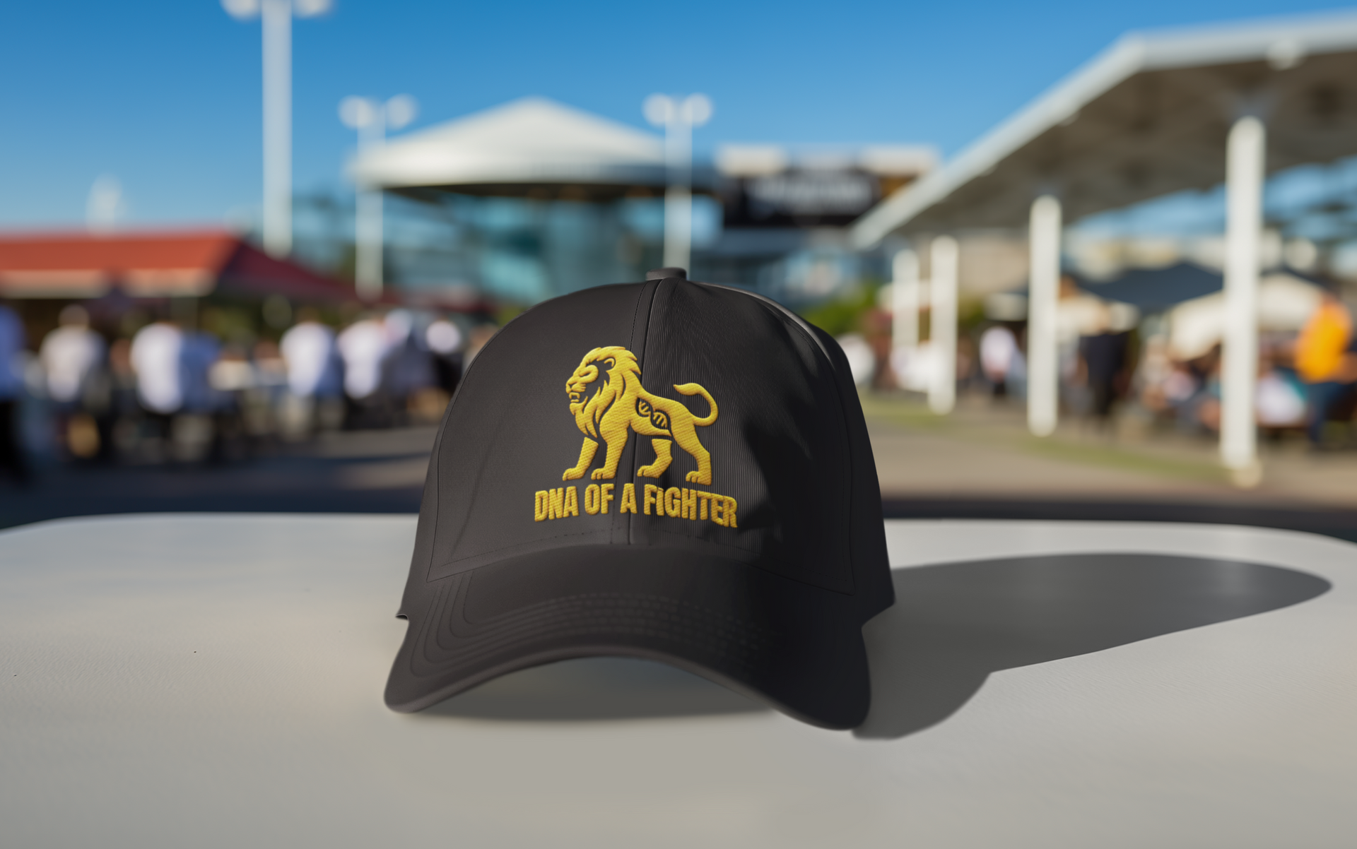 Dad Hat DNA of a Fighter Embroidered – Black embroidered cap with lion design photographed outdoors.