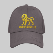 Dad Hat DNA of a Fighter Embroidered – Gray motivational cap featuring golden lion embroidery.