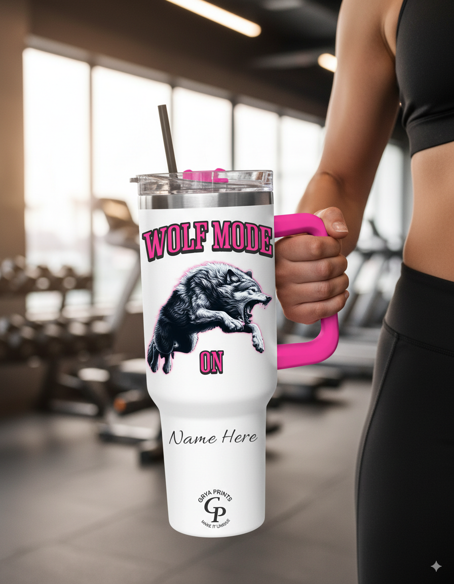 Woman in a gym wearing black sportswear holding a Personalized Tumbler Wolf Mode by the handle.