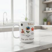 Floral Ceramic Mug Bloom In Your Own Time with motivational phrases and floral design on a kitchen counter.