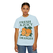 Woman wearing Fresh and Juicy Oranges T Shirt in light blue – cheerful retro fruit design