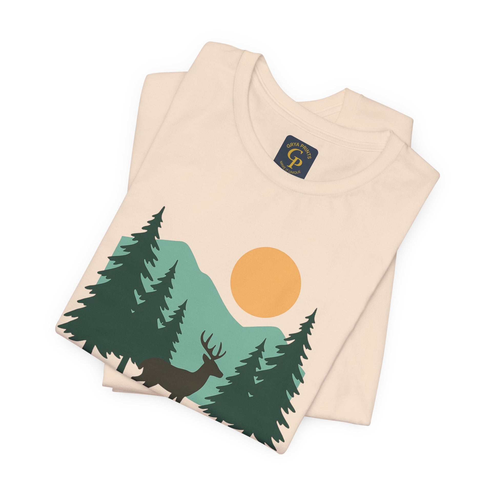 Cream Forest Dreamer T-Shirt with forest illustration, displayed on neutral surface