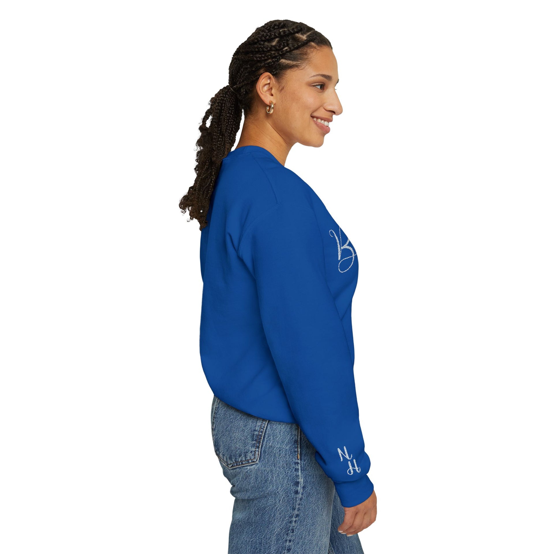 Woman side profile wearing blue Embroidered Kindness Sweatshirt