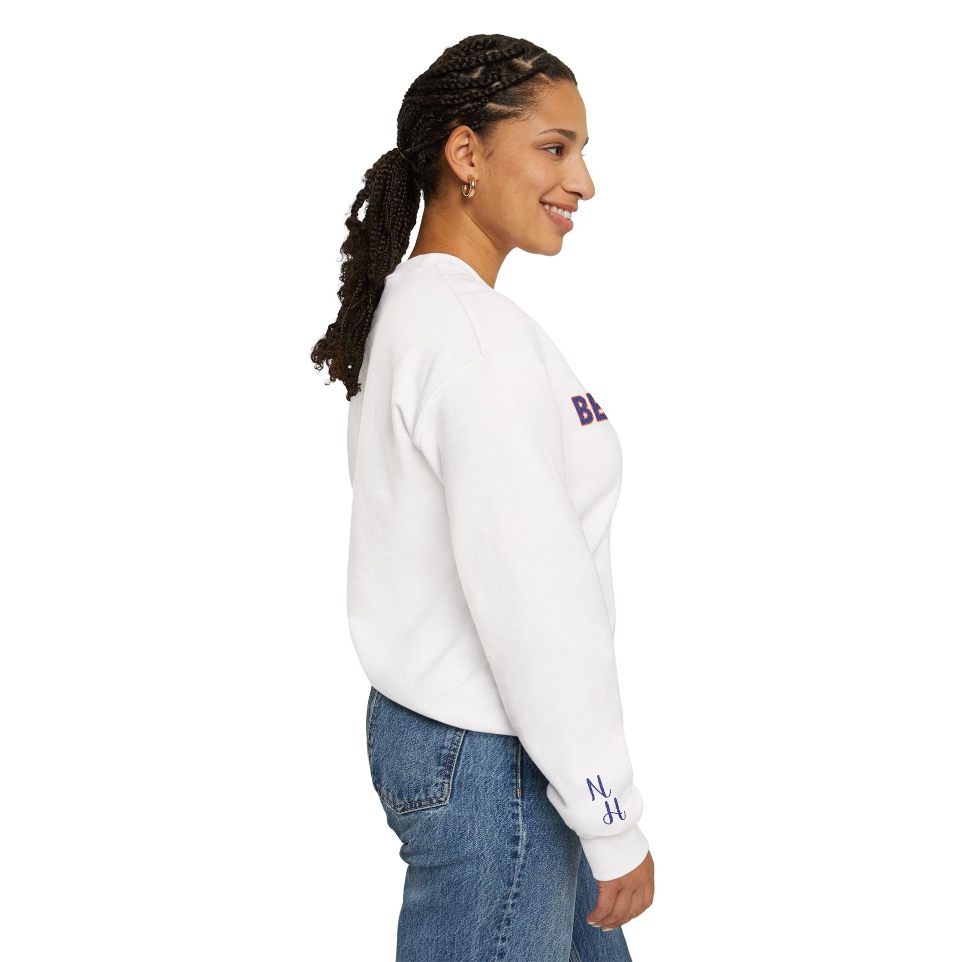 Side view of white Embroidered Motivational Sweatshirt worn by woman