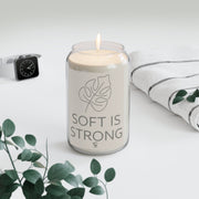 Soft Is Strong Candle with minimalist leaf design on white background